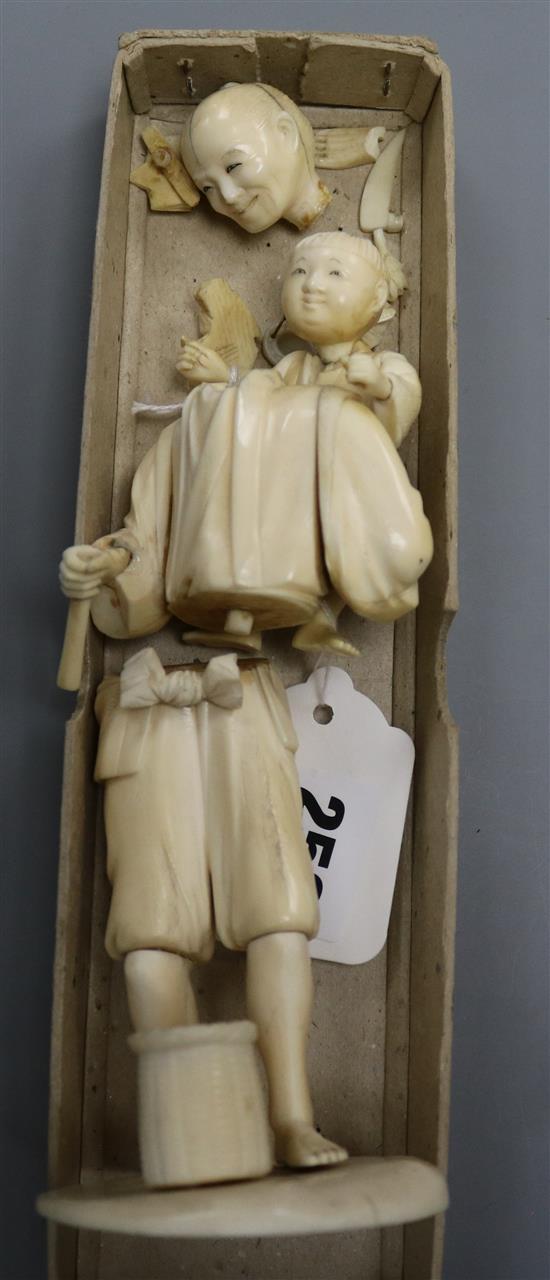 A Japanese ivory group of father carrying child